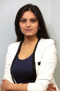 Aanchal Sood smiling, in a portrait photograph