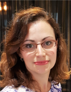 Lana Lubomirska wearing glasses, in a portrait photograph