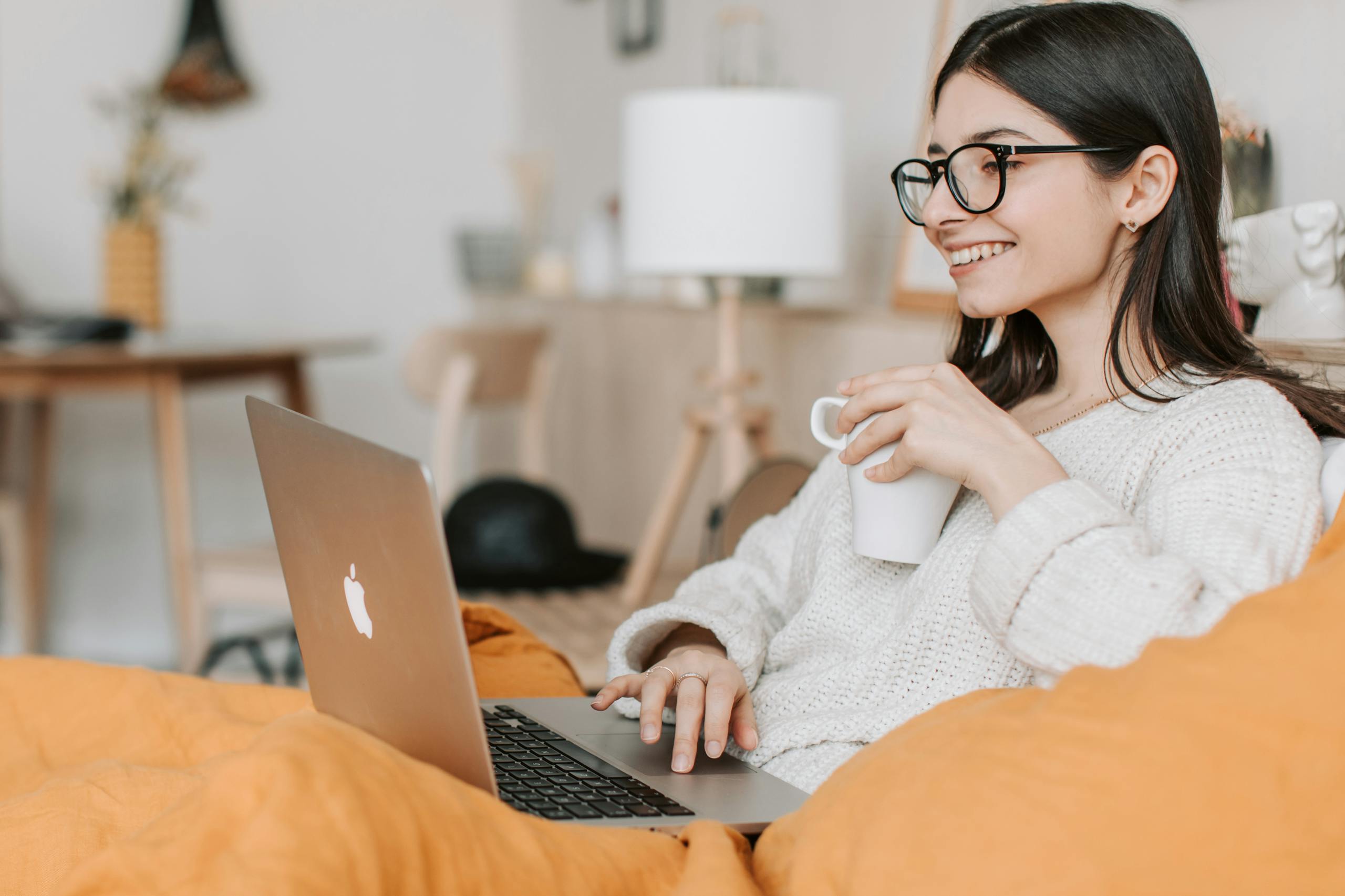 A woman engaging in telehealth therapy from the comfort of her home