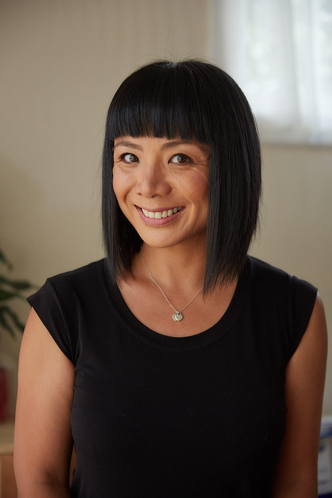 Thanh Lee, Psychologist at Thanh Lee Psychology, smiling in a headshot